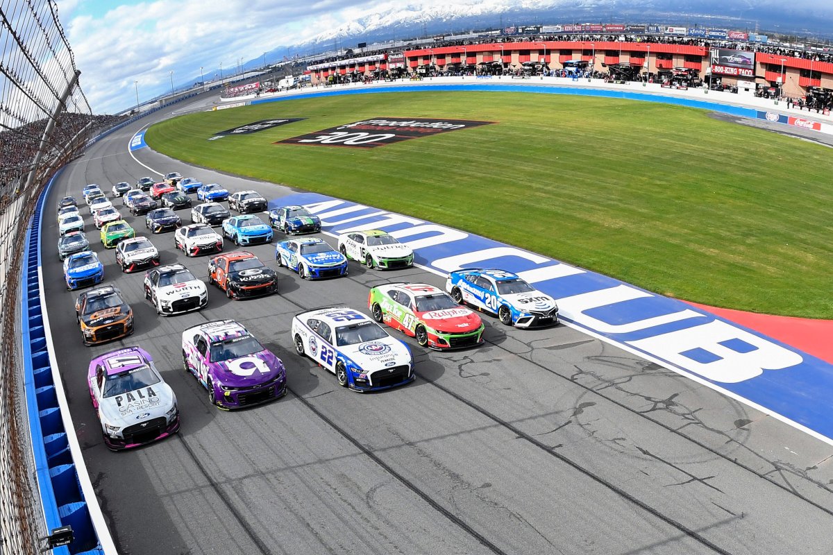 Christopher Bell, 2023 Daytona 500 winner Ricky Stenhouse Jr., Joey Logano, Alex Bowman and Chris Buescher lead the field in a five-wide salute to the fans prior to the Pala Casino 400 at Auto Club Speedway. (Photo by Logan Riely/Getty Images)